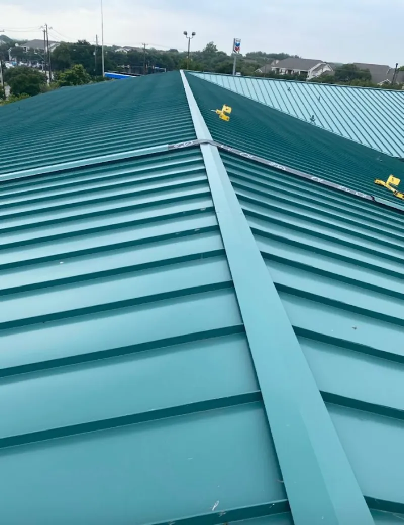 Green commercial metal roof ridge and valley for Metal Roof Repair in Littlefield
